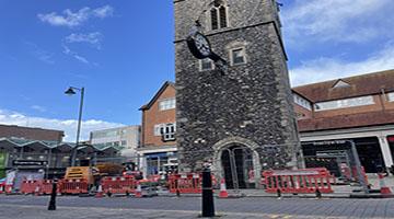Clocktower surrounded by barriers