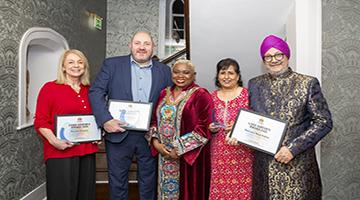 Group photo of the winners holding their certificates