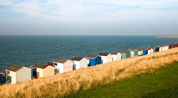 Row of beach huts facing the sea
